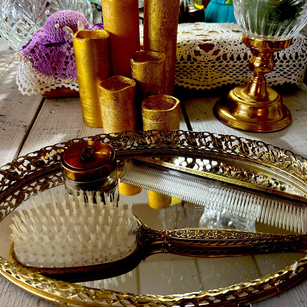 Vintage hair brush, comb, mirror tray, and face cream glass container.
